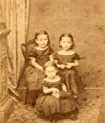 Annie, seated left with her two younger sisters, Mary and Lizzie. (nd)